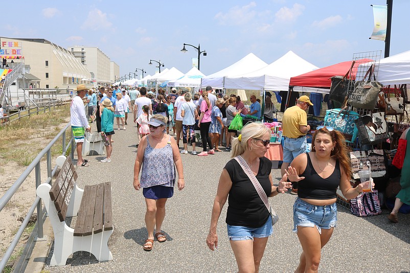 Vendors' tents line the Promenade for a shopping extravaganza during the opening day of the Skimmer Festival.