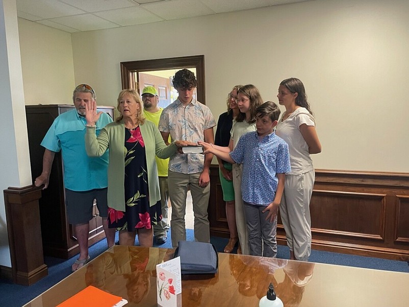 E. Marie Hayes becomes the new Cape May County surrogate during a swearing in ceremony Thursday with her husband, Lloyd, at left, son Henry Lloyd, daughter Danielle and grandchildren Michael, Lauren, Audrey and Vincent. (Photo courtesy of E. Marie Hayes)