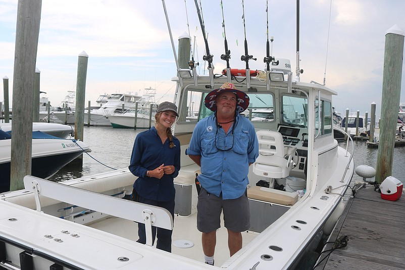 Mighty Heron Charters owner Michael Doebley is joined by crew member Logan Monteleone on the company's 28-foot fishing boat.