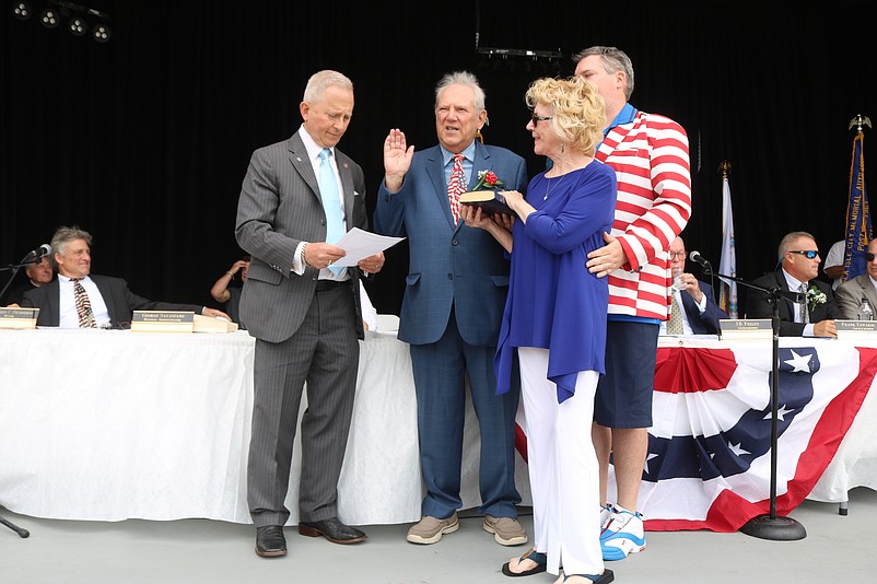 Councilman William Kehner Sr. is joined by his wife, Cheryl, and son, William Jr., while he is sworn in by Congressman Jeff Van Drew.