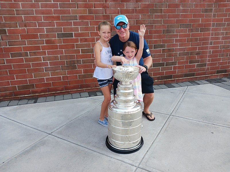 Sea Isle Police Lt. James McQuillen is joined by his daughters, Avery and Rylee, for a family picture with the cup.