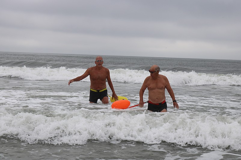 Al Kraus, left, and Bill Gallagher take to the water for one of the swims they have been doing together for nearly 60 years.