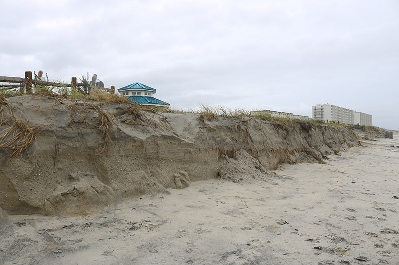 A line of dunes at John F. Kennedy Boulevard is sheared away by Tropical Storm Ophelia.