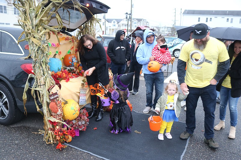 Kids make their rounds at the library's parking lot for some candy during Trunk-or-Treat.