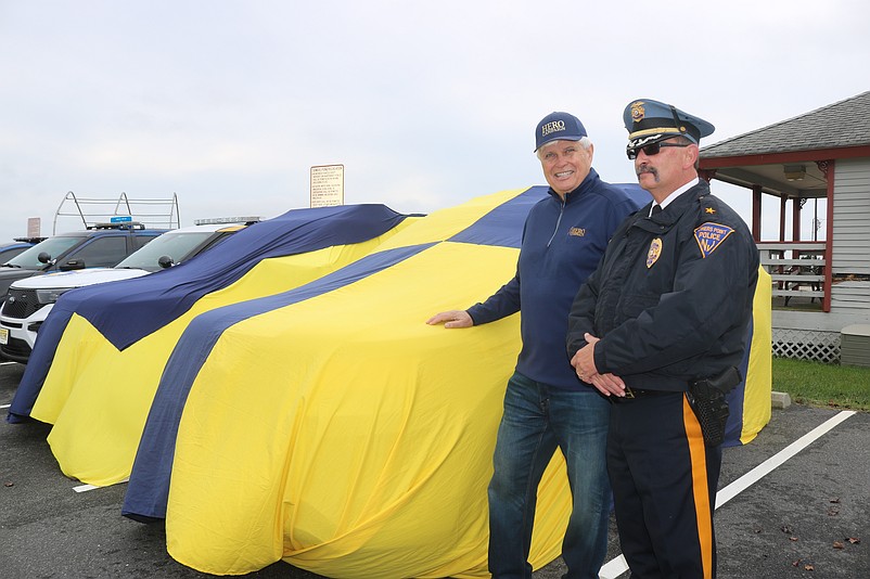 HERO Campaign Chairman Bill Elliott and Somers Point Police Chief Robert Somers stand alongside the newly wrapped patrol vehicle during an unveiling ceremony Wednesday.