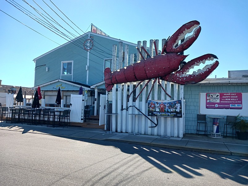 The big, red lobster emblem that decorates the front entrance of the Oar House Pub is part of the sale.