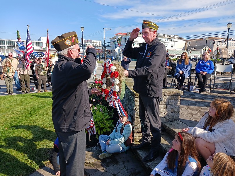 VFW Post 1963 Commander Joe McLenaghan, right, exchanges a salute during the wreath laying ceremony.