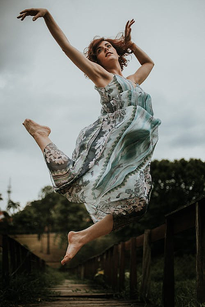 https://www.pexels.com/photo/woman-jumping-wearing-green-1930364/