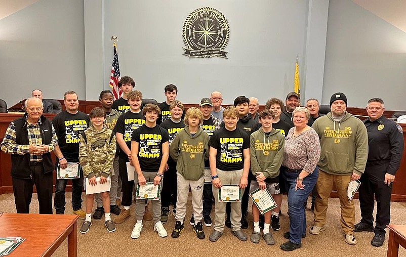 Players and coaches from the championship Upper Township football team are joined by Sea Isle City officials for a group photo during the ceremony. (Photo courtesy of Sea Isle City)