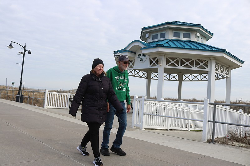 Eileen and Mark Rose, of Sea Isle, take their traditional Christmas Day walk on the Promenade.