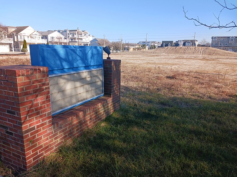 The front sign is all that remains of the old school at the site.