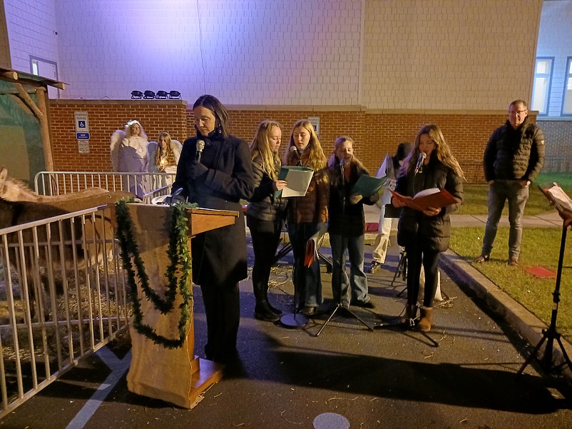 Narrator Mary Beth Libro, left, describes pivotal moments of the birth of Jesus, while the singing group Cherub Angels accompanies her with classic Christmas tunes.