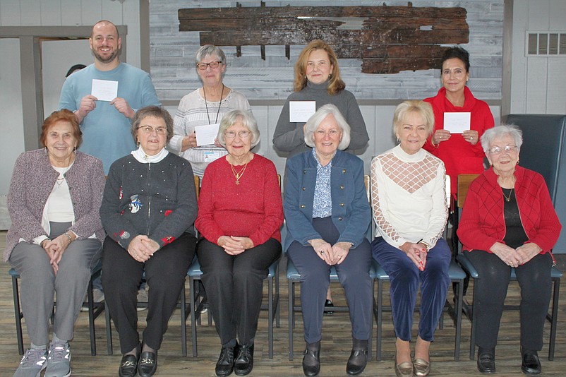 Members of the Sea Isle City Women's Civic Club present checks to four local charities. (Photo courtesy of Sea Isle City)