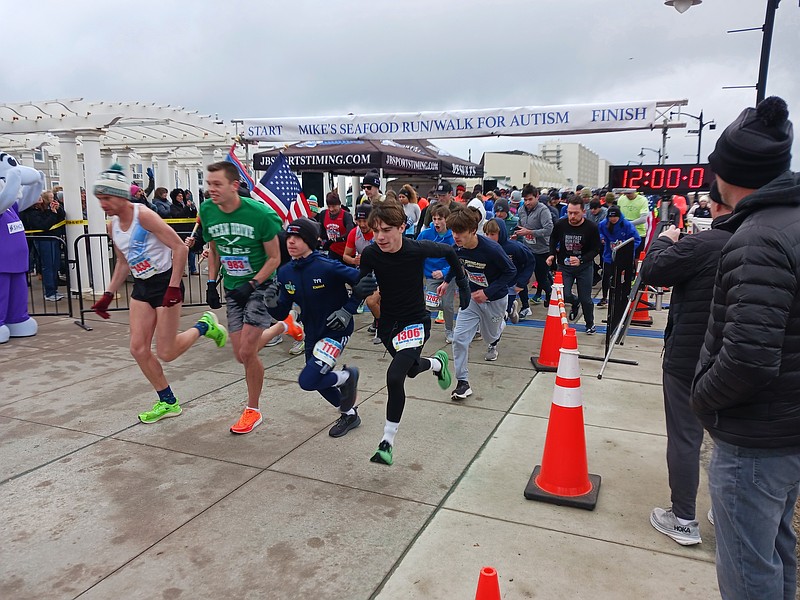 Runners take off at the starting line on the Promenade during the 2024 fundraising event.