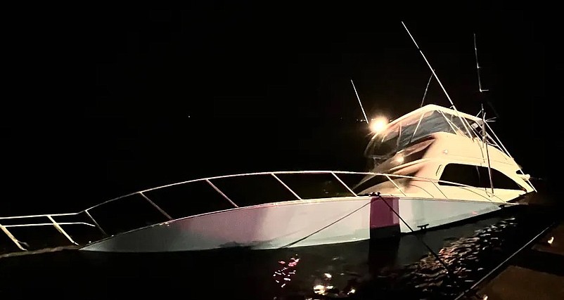 A 52-foot yacht nearly sank after colliding with the bridge in 2023. (Photo courtesy of U.S. Coast Guard)