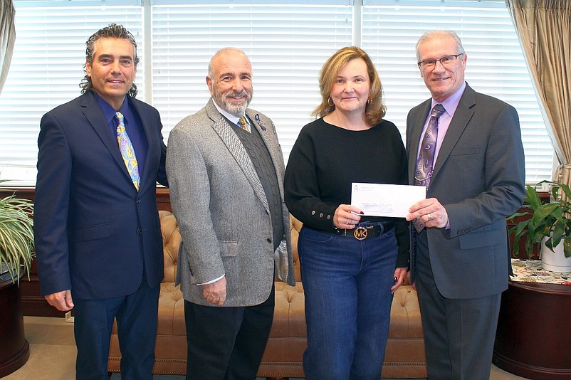 Melissa Doyle-Waid, pastor of Sea Isle City United Methodist Church, is shown accepting the donation from First Bank of Sea Isle City.  (Photos courtesy of Sea Isle City)