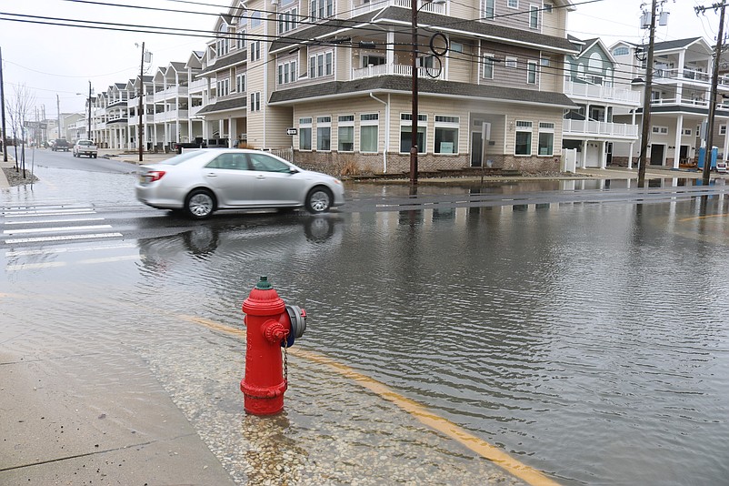 A car crawls through flooding on Landis Avenue at 36th Street in Sea Isle City during the last significant storm in February.