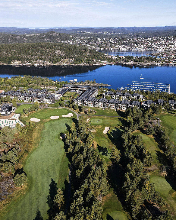 Source: Erik Holm, via https://unsplash.com/photos/an-aerial-view-of-a-golf-course-with-a-lake-in-the-background-dg2TExXRTiI