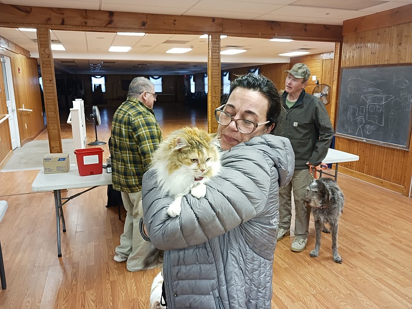 Jackie White holds her Maine Coon cat, named Lacey.