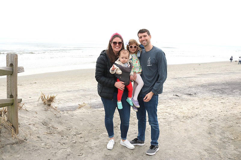 Roxy and Russell Paulson enjoy Easter Sunday by taking a trip to the beach with their daughters, Marley and Holly.