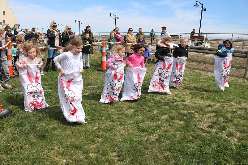 Kids compete in the sack races.