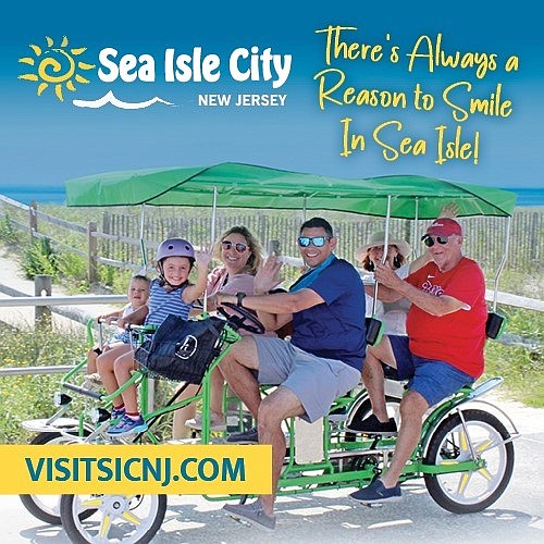 The smiling family enjoys Sea Isle City's Promenade in new marketing materials for the summer of 2024. (Image courtesy of Mickey Coskey and Sea Isle City)