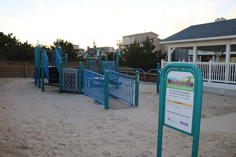 The beachfront public restroom at 85th Street is next to a children's playground.