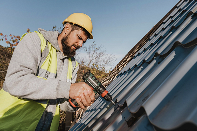 Image source - https://www.freepik.com/free-photo/sideways-man-working-roof-with-drill_11106226.htm