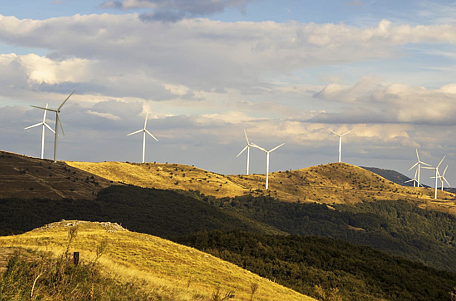 Image source - https://www.pexels.com/photo/white-wind-turbines-on-green-grass-field-under-the-sky-9635533/