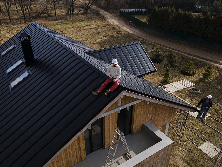 Image source - https://www.freepik.com/free-photo/long-shot-man-with-helmet-sitting-roof_24489312.htm