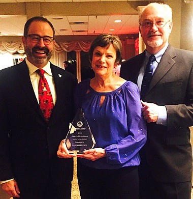 The Somers Point Business Association (SPBA) honored Lois Hirschman Gregory, SPBA secretary, with the 2016 Award of Excellence, inspired by the late Lou DeScioli, during its annual Holiday Party December 6. (L-R: John Davidson, SPBA president; Lois Hirschman Gregory, SPBA secretary; and Walt Gregory, SPBA community relations & projects chairman). Photo Credit:  Suasion Communications Group