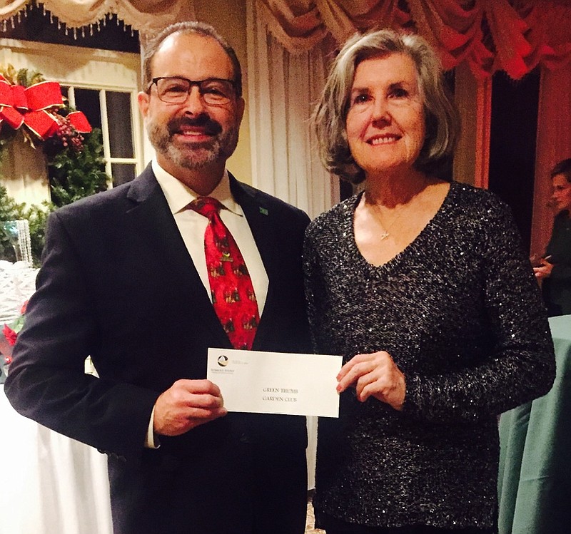 Somers Point Business Association (SPBA) President John Davidson presents a $400 donation to the Somers Point Green Thumb Garden Club president Rosemary Evans during the SPBA’s annual Holiday Party December 6. Photo Credit: Suasion Communications Group 