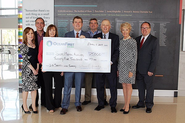 OceanFirst Bank presented The Auxiliary of Shore Medical Center with a $25,000 donation in support of its 63rd Annual D. Allen Stretch Golf Tournament happening June 7 at Greate Bay Country Club. Pictured left to right is: Tricia Ciliberto, vice president, OceanFirst Bank; Bob Robertson, administrative director of logistics, Shore Medical Center; Heidi Angelastro, president, Shore Auxiliary; David Hughes, chief financial officer and chief development officer, Shore Medical Center; Brad Foltz, director of plant operations and maintenance, Shore Medical Center; Steven Brady, vice chairman, OceanFirst Bank; Jean Jacobson, vice president, OceanFirst Bank; and Jeff Ropiecki, vice president, OceanFirst Bank.