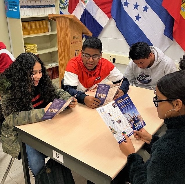 ESL students at Egg Harbor Township High School students use HERO Campaign promotional brochures to study English and Spanish languages. (Photo courtesy of HERO Campaign)