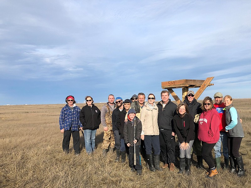 Somers Point Community-First members stand by their new creations, osprey nests they made and installed. (Courtesy Somers Point Community-First)