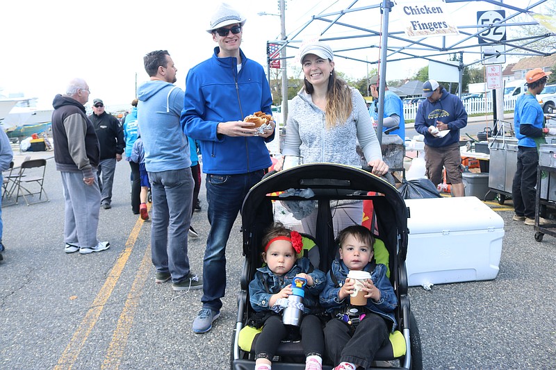 Brian Livings holds up his huge "Newark Style" sausage and pepper sandwich with friend, Rachel Stagliano, of Egg Harbor Township, accompanying him, along with her 2-year-old twins, Arya and Derrick.