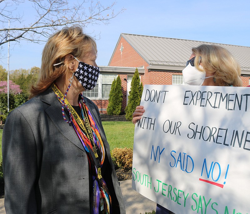 Commissioner E. Marie Hayes, left, speaks with Martha Oldach, of Ocean City.