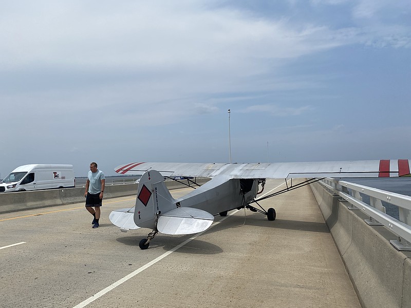 The pilot makes an emergency landing on the bridge without damaging the plane or hitting any motor vehicle traffic. (Photos courtesy of Ocean City Public Information Office)