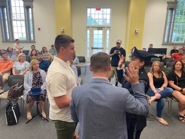 New Lansdale police Officer Karly Harney, center right, receives her oath from Mayor Garry Herbert during the council meeting on July 19, 2023. (Photo courtesy of Lansdale Police Department)