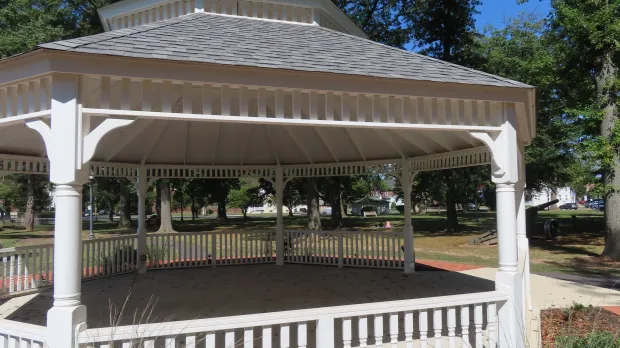 Sunbathers can be seen through the gazebo in Memorial Park in Lansdale in Sept. 2023. (Dan Sokil - MediaNews Group)