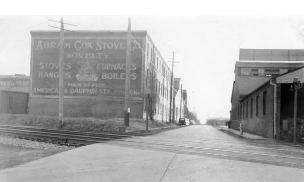 The Abram Cox Stove Company building at 501 N. Cannon Avenue is seen at left, on Cannon Avenue facing south toward Main Street, in a photo from around 1930.
