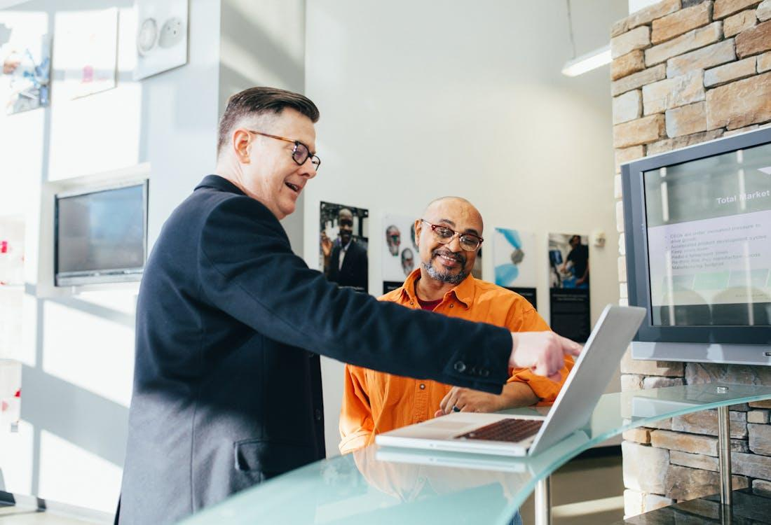 Free Man Pointing Laptop Computer Stock Photo