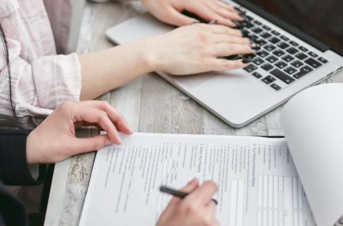 Free A Person Typing on Laptop Stock Photo