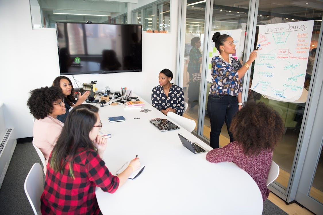 Free Women Colleagues gathered inside Conference Room  Stock Photo