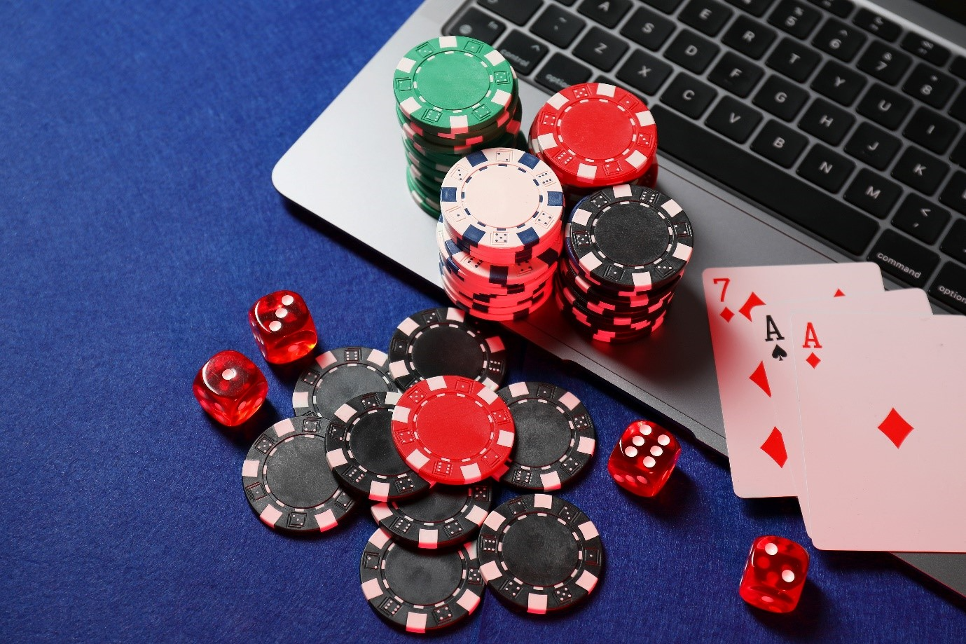 A computer with poker chips and cards on it

AI-generated content may be incorrect.
