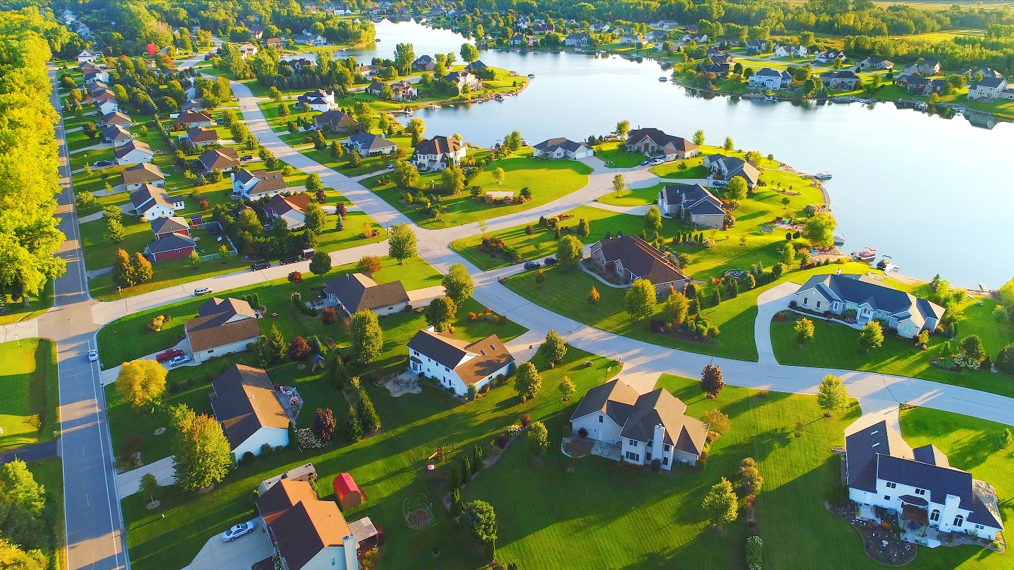 Aerial view of houses near a canal