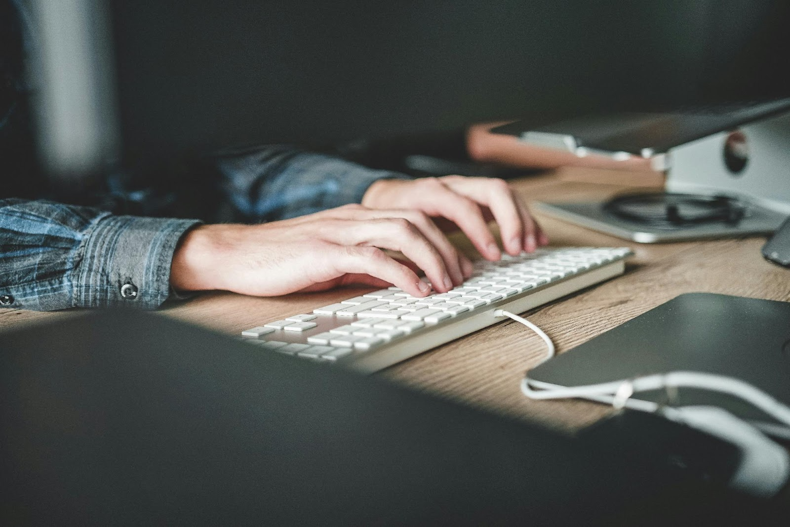 a person typing on a keyboard