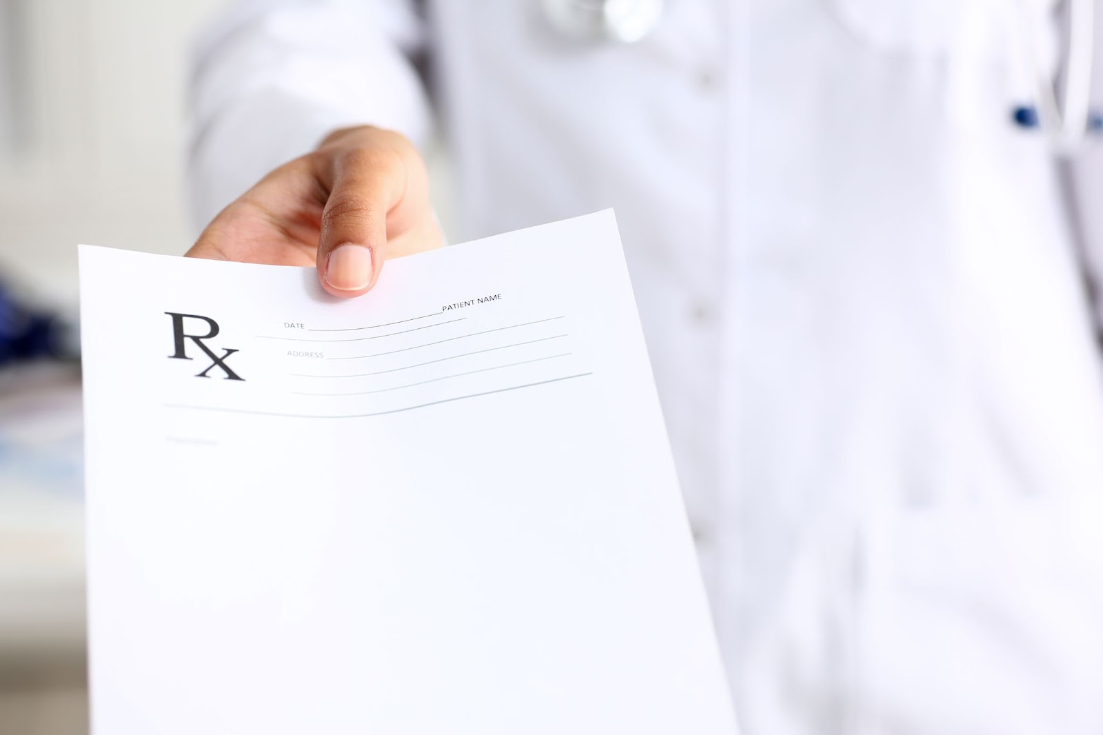 A doctor holding a prescription

AI-generated content may be incorrect.