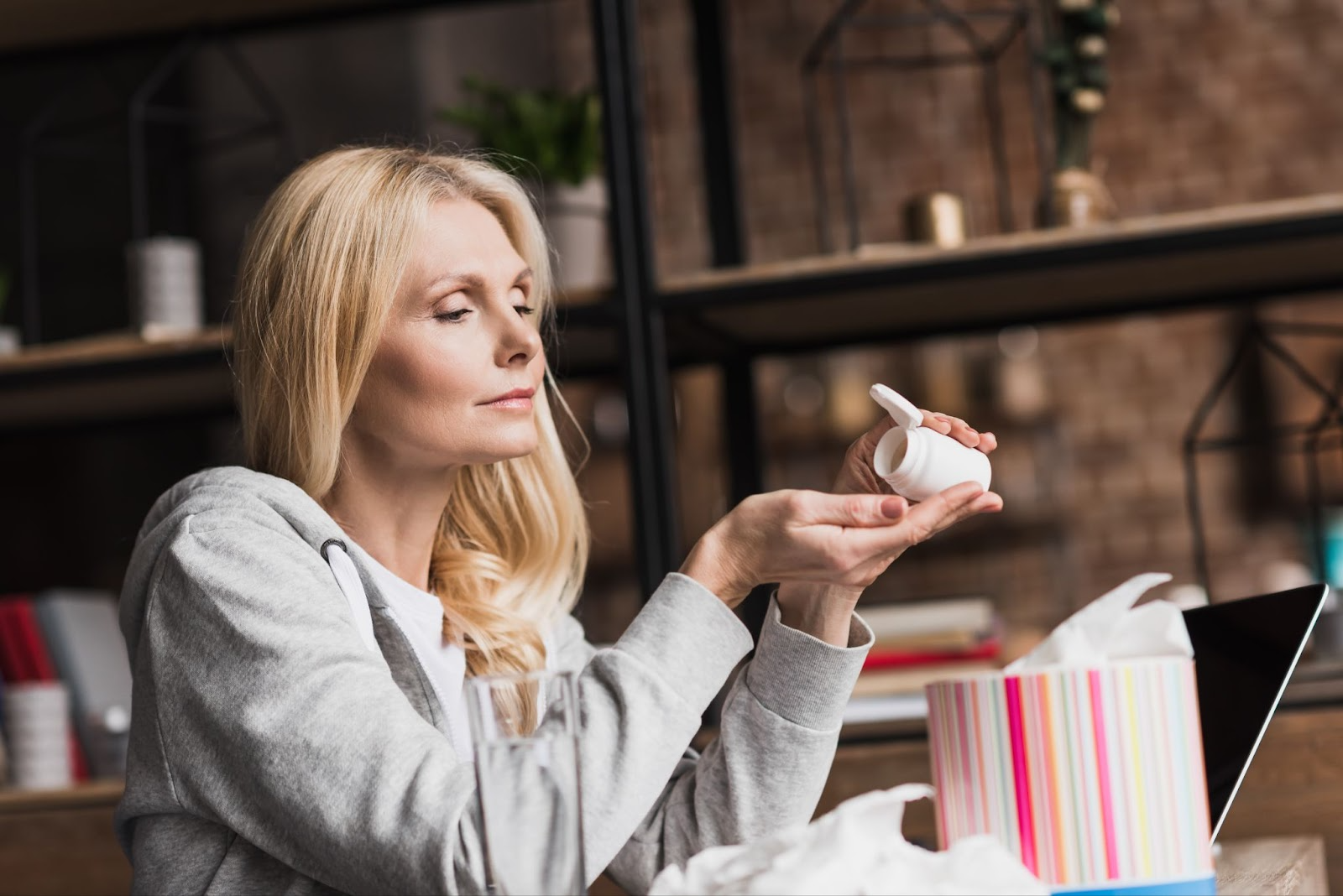 A person holding a small white container

AI-generated content may be incorrect.