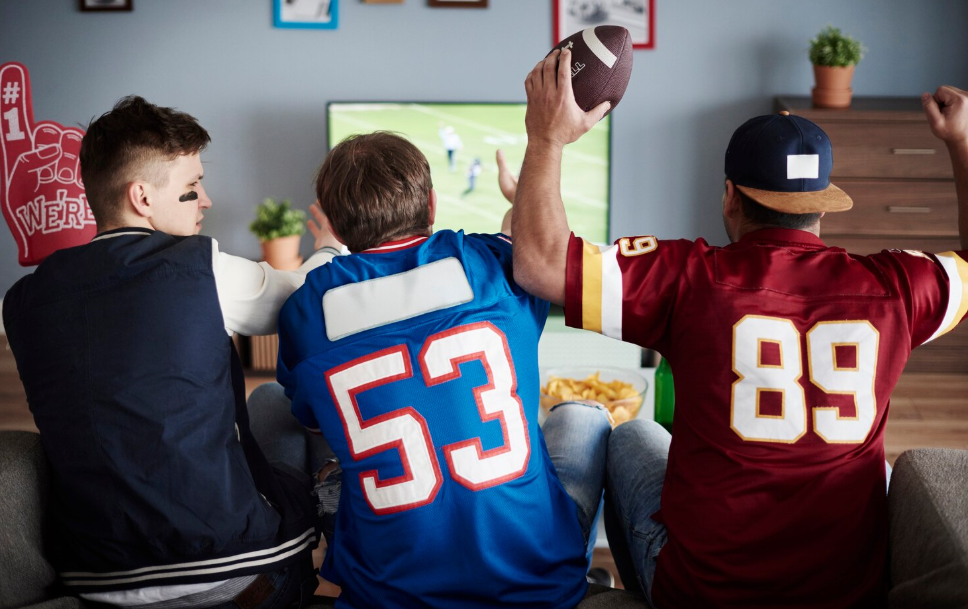 Chicago Cubs fans enjoying match in front of TV